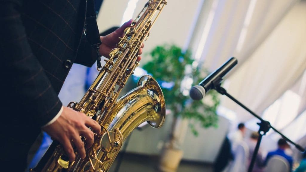 Wedding DJ Packages with live saxophone performance at a reception