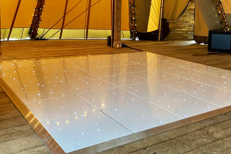 White LED dance floor with Oxford wedding DJ entertainment at a marquee wedding